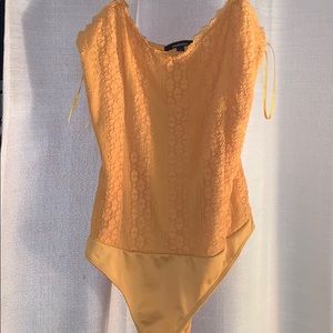 Yellow lace body suit